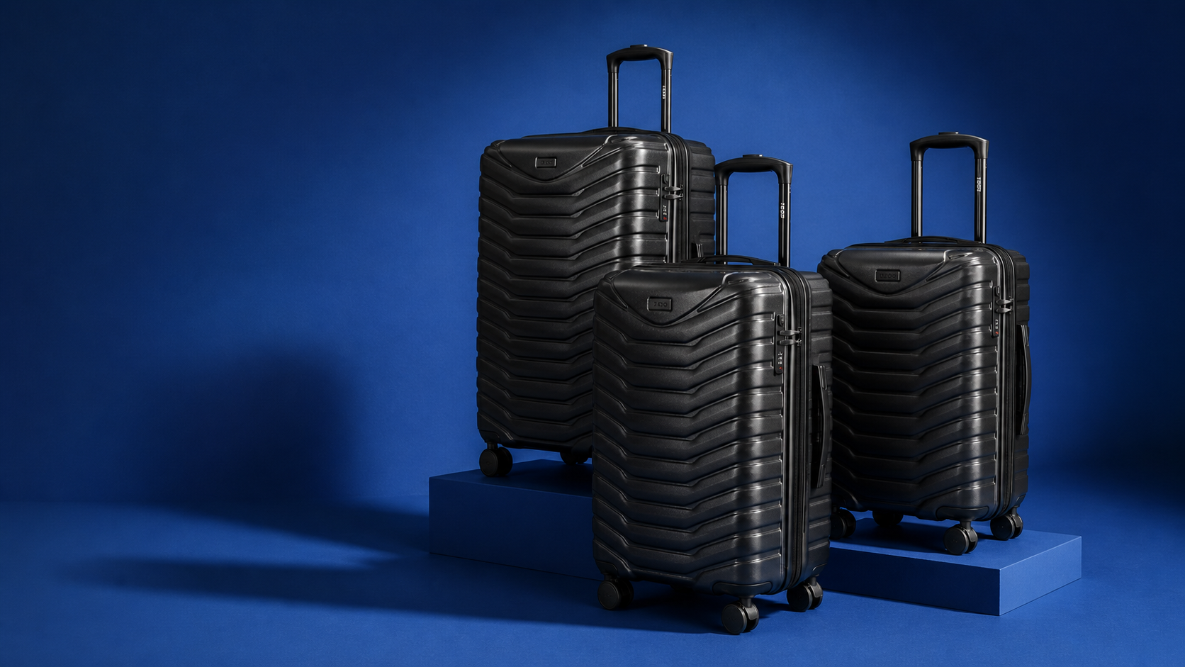 Pantom luggage in a blue studio setting